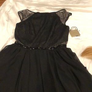 BRAND NEW black fit and flare party dress.